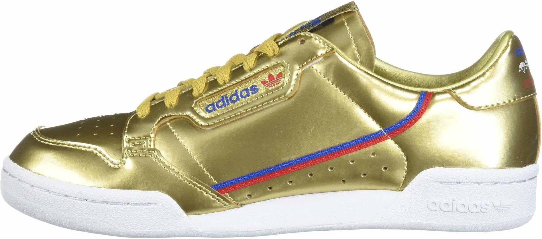 white adidas shoes with gold
