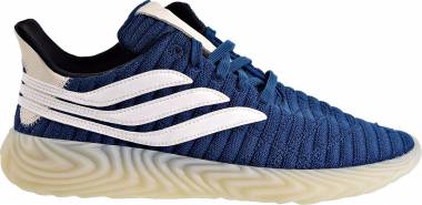 navy blue and white adidas shoes