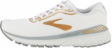 white and gold brooks running shoes