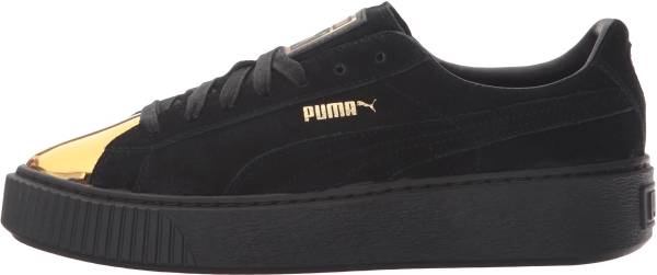 gold and black puma shoes