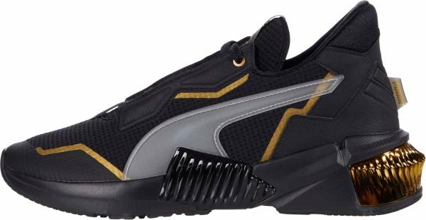 gold and black puma shoes