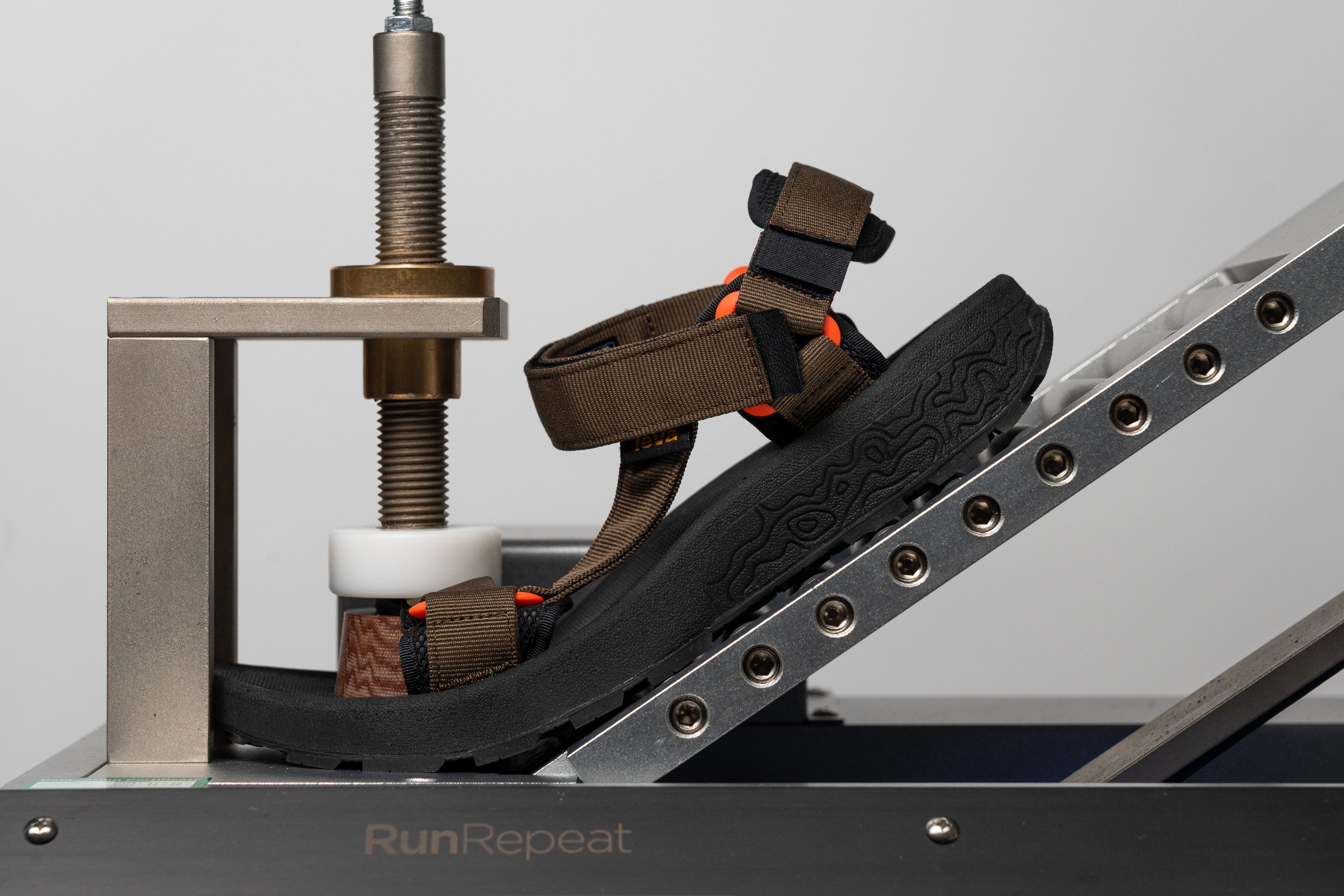 testing the stiffness of hiking sandals