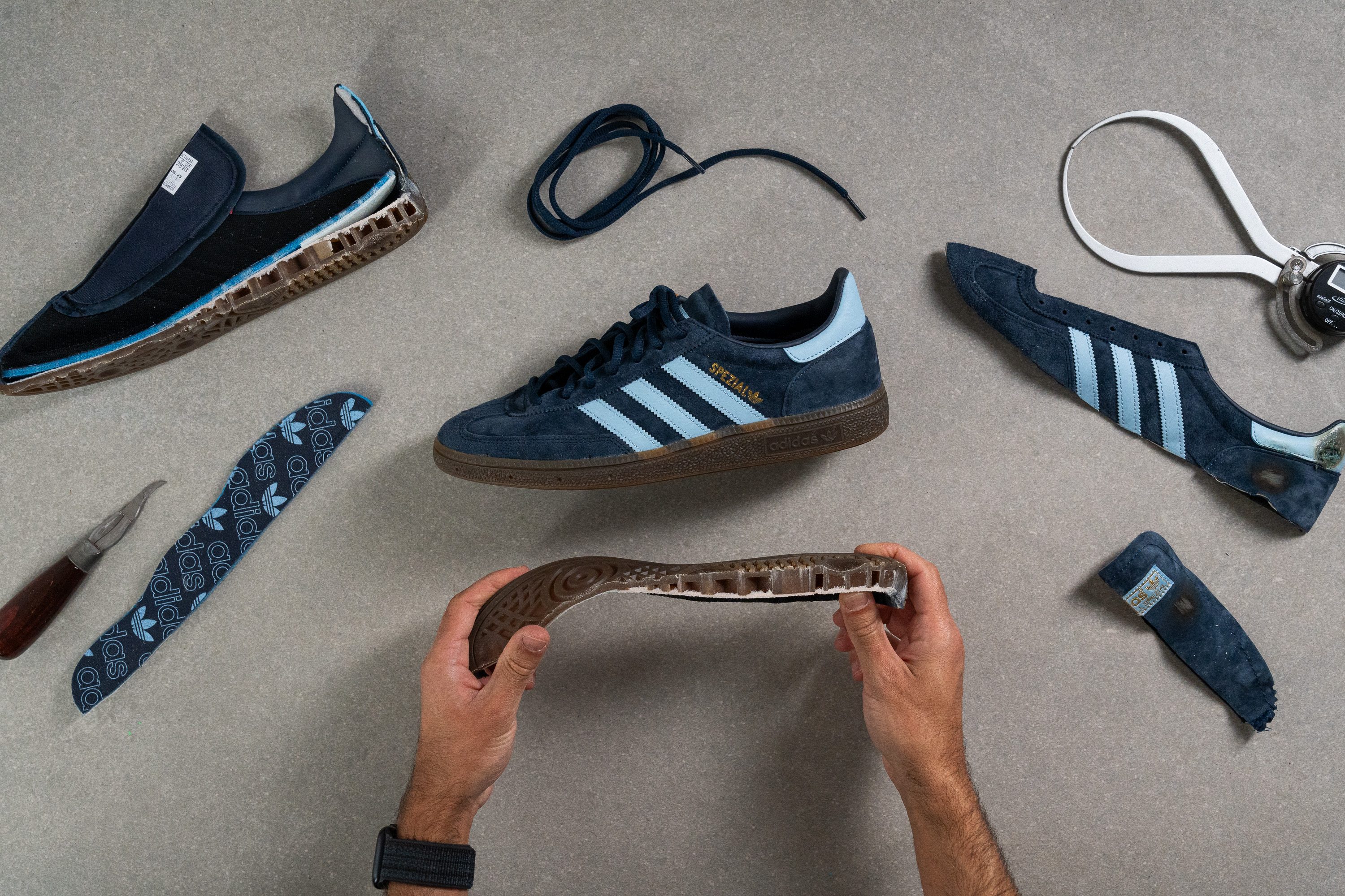 business casual sneakers torn into pieces for lab testing