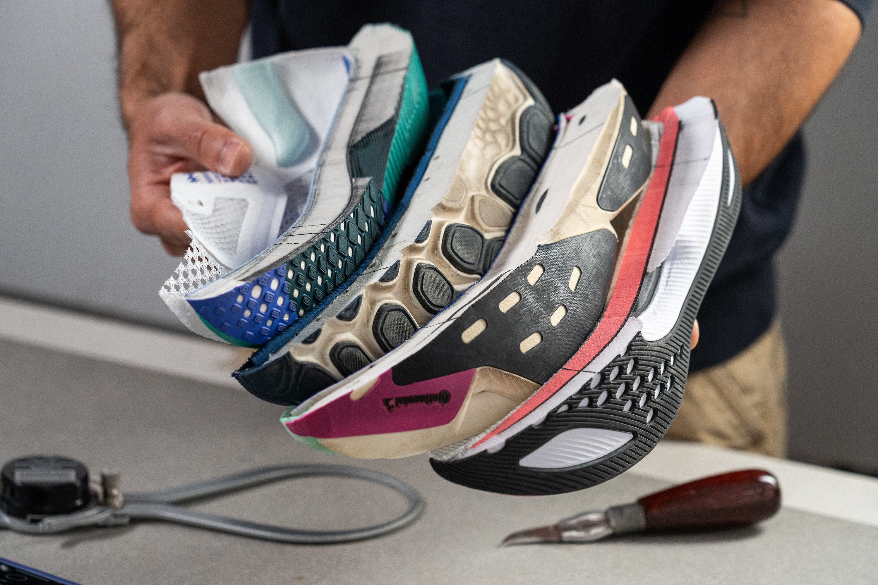 shoes cut in half ready to get their stack heights measured