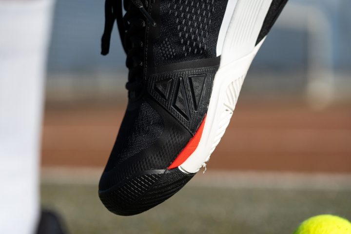 which is heavier but has a more one-to-one fit and a wider, steadier platform toe drag guard