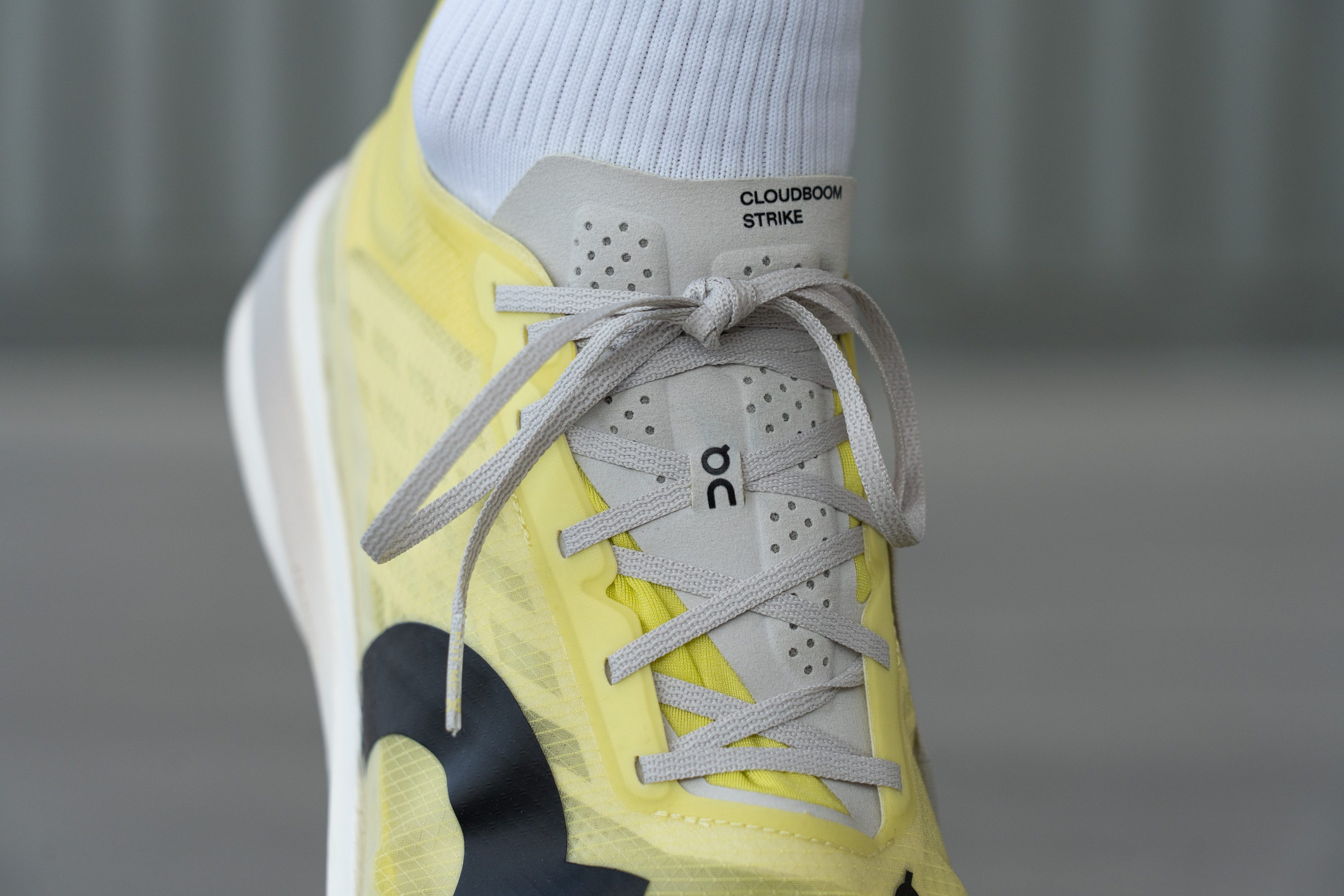 On Cloudboom Strike tongue laces